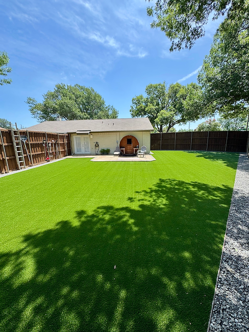Full Backyard Artificial Turf Installation with Landscape Rock Border in Garland, TX